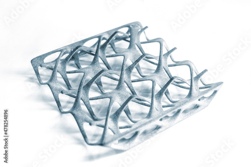 Gray abstract model printed on 3d printer from powder isolated on white background. 3D prototype created by 3d printing technology. Multi Jet Fusion MJF. Concept new modern hi-technology 3d printing