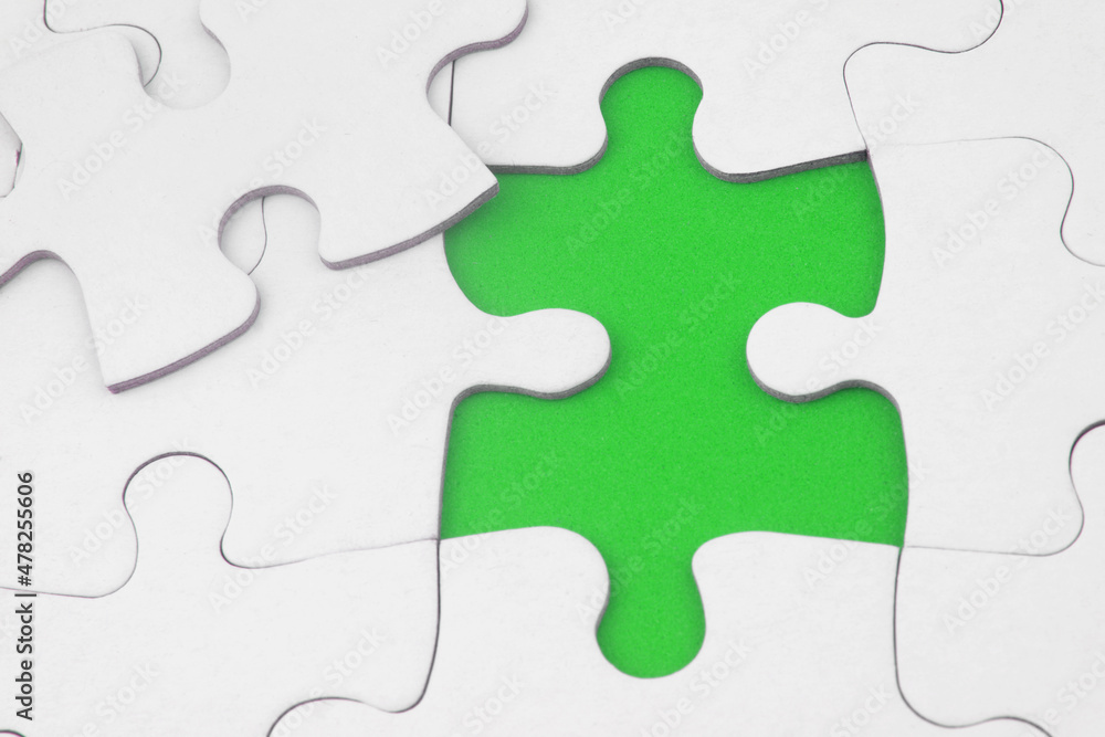White jigsaw puzzles, one piece disconnected. Business strategy, teamwork, problem solving and complete mission concept. White jigsaw puzzles, one piece disconnected. Business strategy, teamwork, problem solving and complete mission concept.