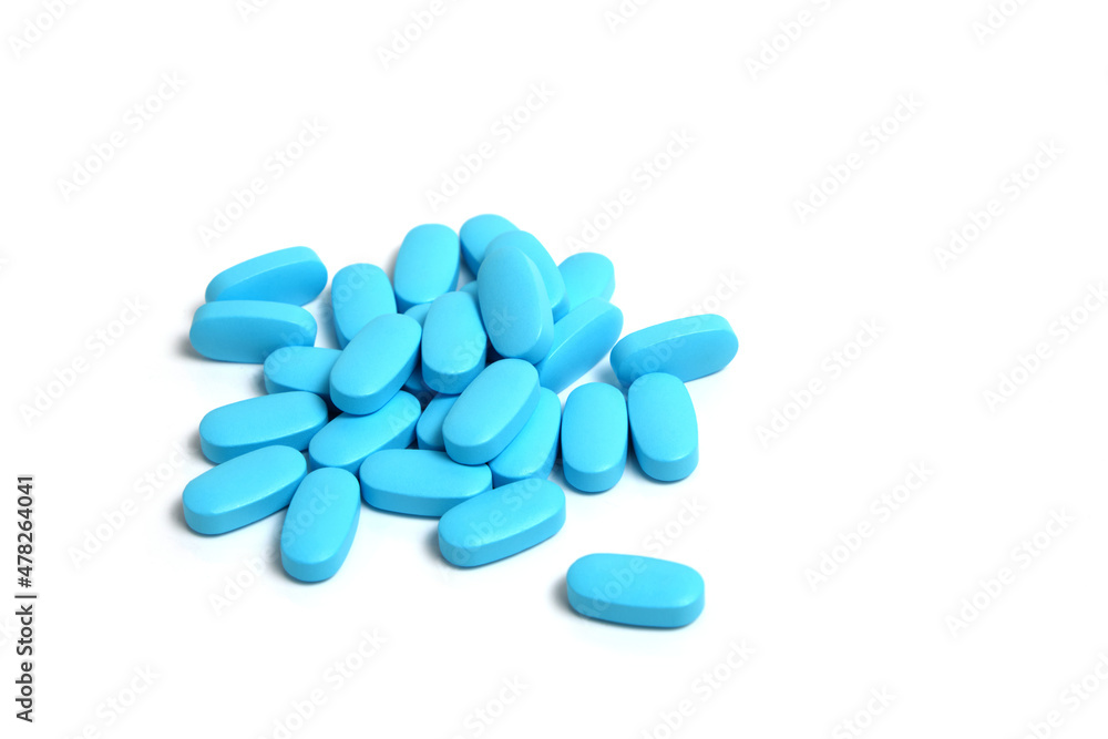 Blue pills, vitamins on a white background. Blue pills, vitamins on a white background.