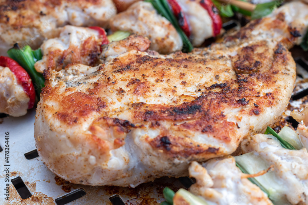 Chicken breast and pork meat pulled in wooden skewer with fresh colorful and tasty vegetables Chicken breast and pork meat pulled in wooden skewer with fresh colorful and tasty vegetables