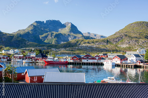 Beautiful Sorvagen village in nothern Norway, southwest Lofoten, village with typical wooden red cabins photo