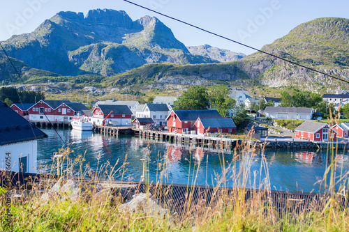 Beautiful Sorvagen village in nothern Norway, southwest Lofoten, village with typical wooden red cabins photo