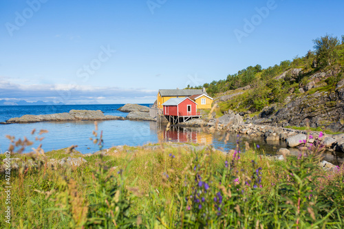 Beautiful Sorvagen village in nothern Norway, southwest Lofoten, village with typical wooden red cabins photo