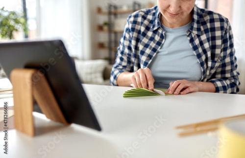 Wallpaper Mural diy, art and hobby concept - close up of happy smiling woman with tablet pc computer making paper craft at home Torontodigital.ca