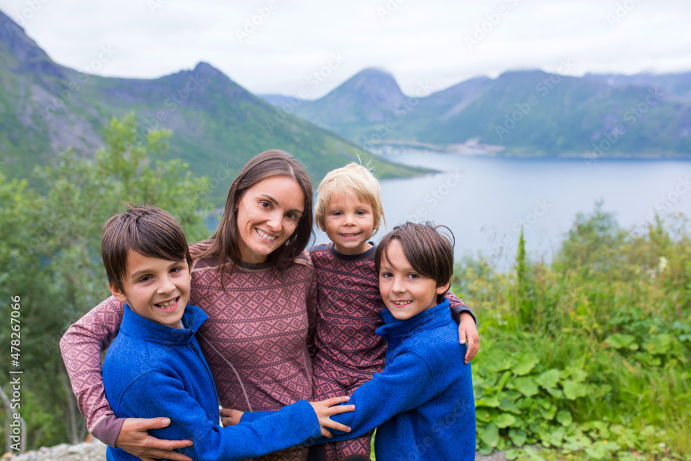 Family, taking portraits on a amazing norwegian nature on the way from Lofoten to Senja island Family, taking portraits on a amazing norwegian nature on the way from Lofoten to Senja island