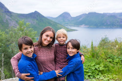 Family, taking portraits on a amazing norwegian nature on the way from Lofoten to Senja island