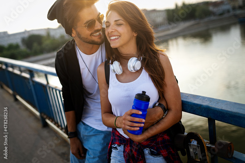 Portrait of happy young couple in love enjoying time together in city. People travel fun concept