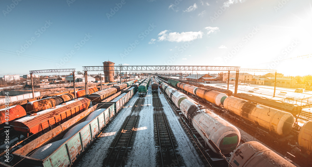 Freight trains from a height at the marshalling yard. Delivery of goods by freight train. Railroad cars at the station Freight trains from a height at the marshalling yard. Delivery of goods by freight train. Railroad cars at the station