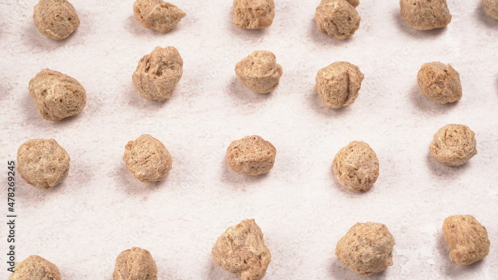Raw soya chunks on dark background. Healthy, nutritious soybean meat, chunks isolated.Vegan food concept.
Raw soya chunks on dark background. Healthy, nutritious soybean meat, chunks isolated.Vegan food concept.