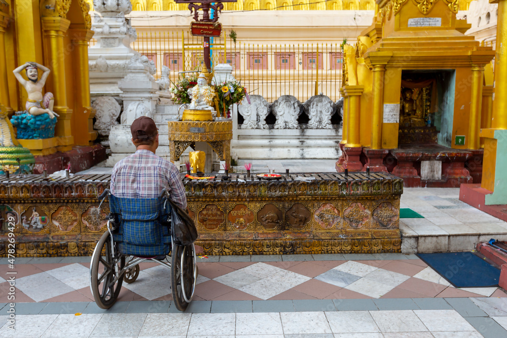 Fototapeta premium Yangon, Myanmar, November 12, 2016: religious belief places, pagodas and daily living spaces