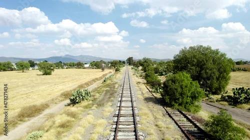 Backwards view with drone of railroad track ride near mexico city photo