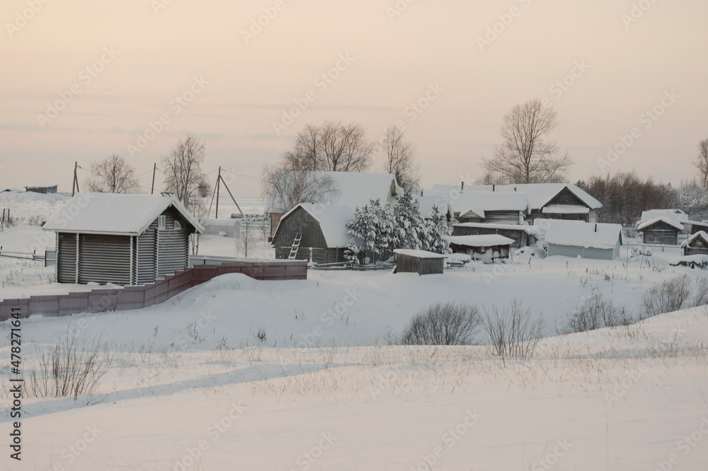 houses in the snow in the village in winter.