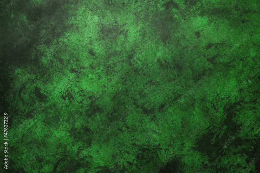 Green weathered wall textured background with emerald tones. Aged wall.