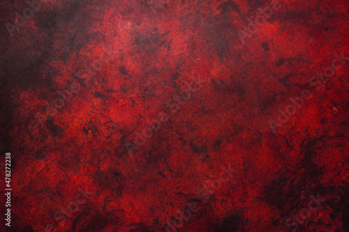 Red weathered wall textured background with garnet tones. Aged wall. photo