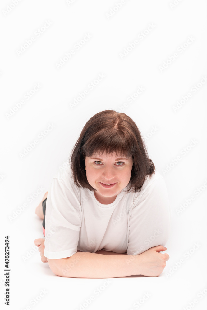 Portrait of charming cute young round-faced woman with dark hair on white background. Vertical frame. Portrait of charming cute young round-faced woman with dark hair on white background. Vertical frame.
