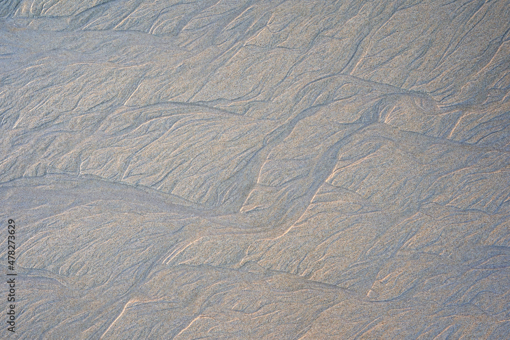 Fototapeta premium Beautiful structures in the brown sand beach. Ideal as background. View from above. Pattern.