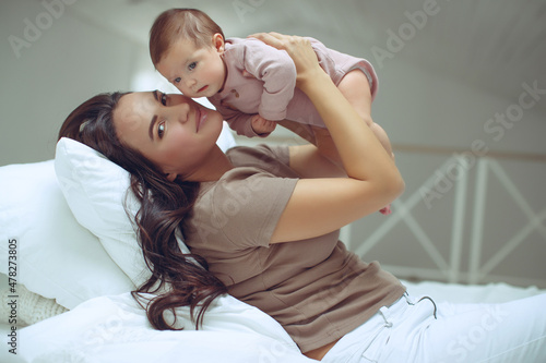 Mom with a baby at home. High quality photo