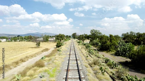 Backwards view of railroad track ride photo