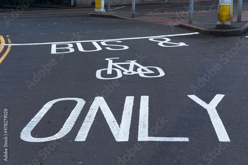 White painted road markings. Bus and cycles only. UK