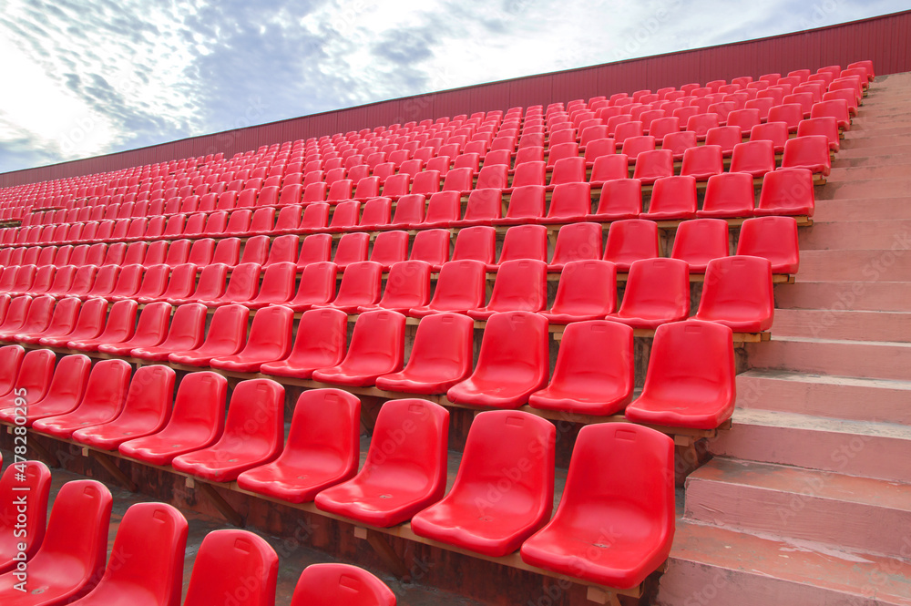 Naklejka premium Red benches in the stadium