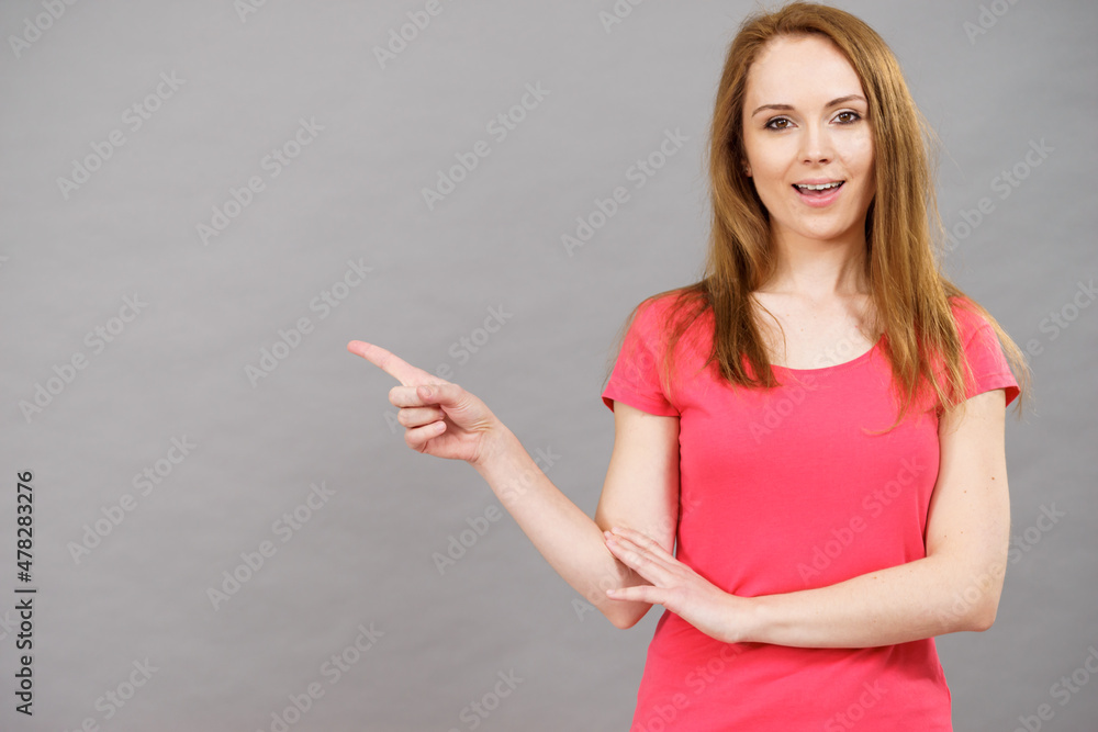 Woman pointing, surprised face expression