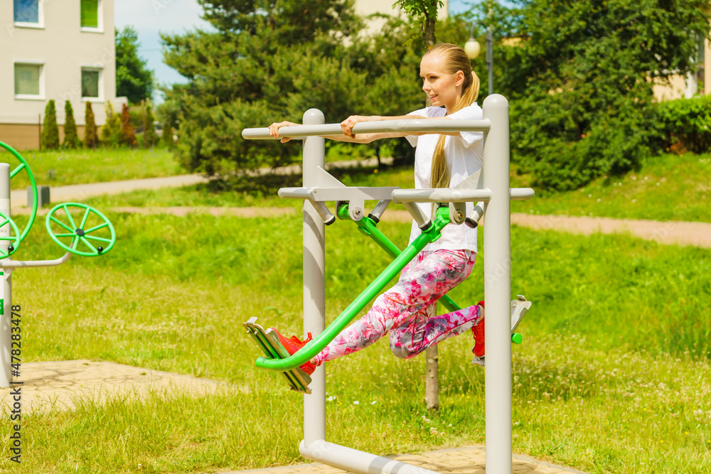 Woman doing exercise in outdoor gym