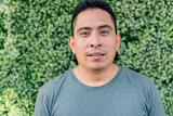 Portrait of young Hispanic man outdoors