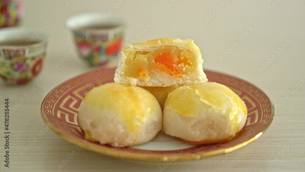 Chinese pastry moon cake with salted egg peanut or Spring Roll pastry with nuts and salted eggs Chinese pastry moon cake with salted egg peanut or Spring Roll pastry with nuts and salted eggs