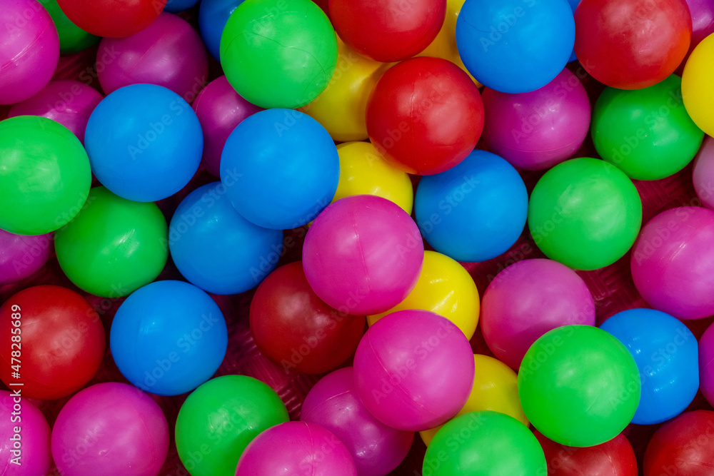 A lot of colorful plastic balls in ball pool A lot of colorful plastic balls in ball pool