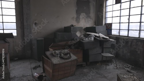 Interior of an abandoned building with a lot of old stuff.