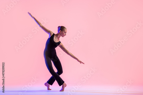 Photography Young teenager dancer dancing on a red studio background