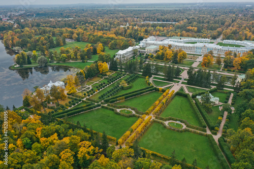 Aerial view of Catherine Park in Tsarskoye Selo of Pushkin, autumn garden from above, patterns and lines of paths, yellow leaves on branches