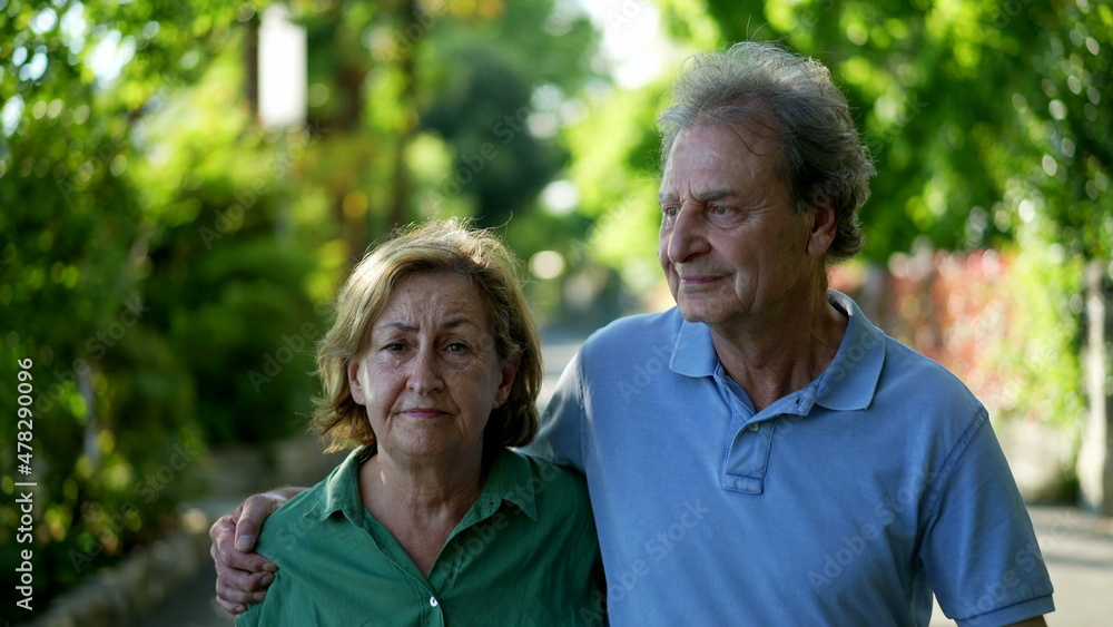 Romantic older couple going for a walk, 60s senior husband and wife together Romantic older couple going for a walk, 60s senior husband and wife together