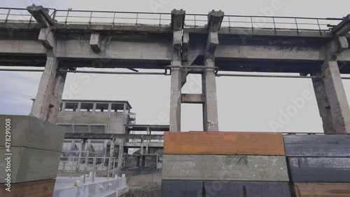 Overview of an abandoned construction site.
Exterior of an old factor building.
Building construction stuff.