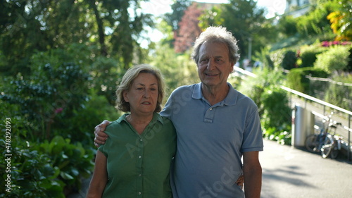 older couple walking together, senior people relationship outside in day walk