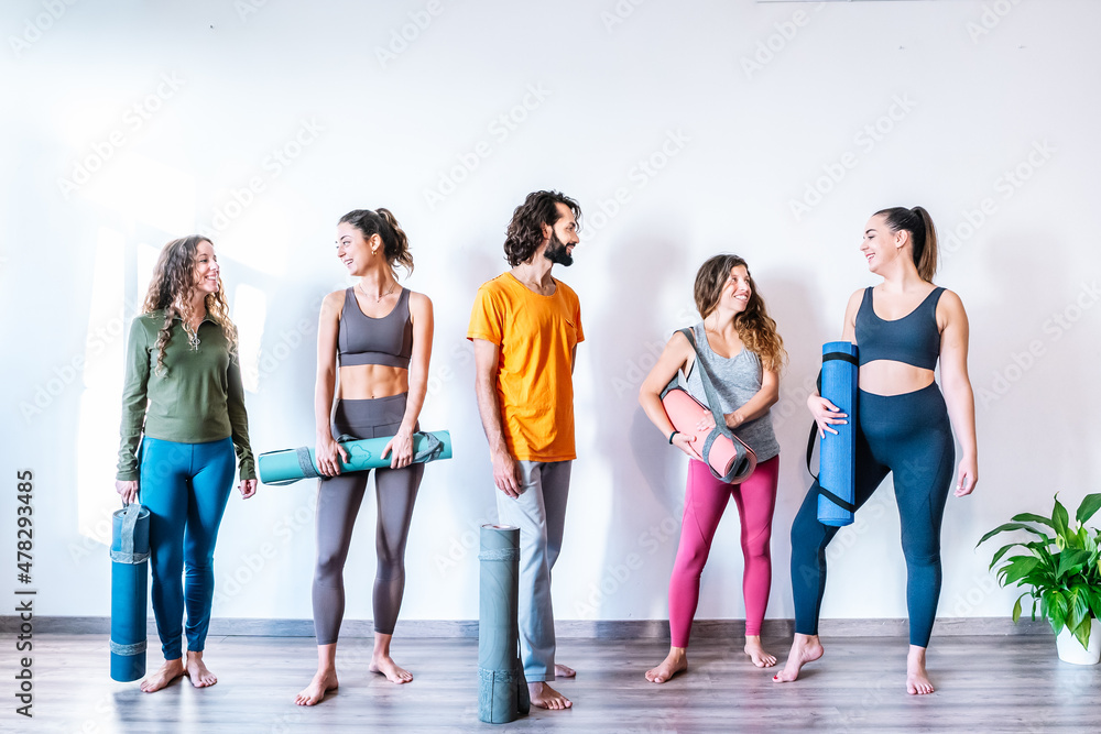 Man and women talking after yoga lesson