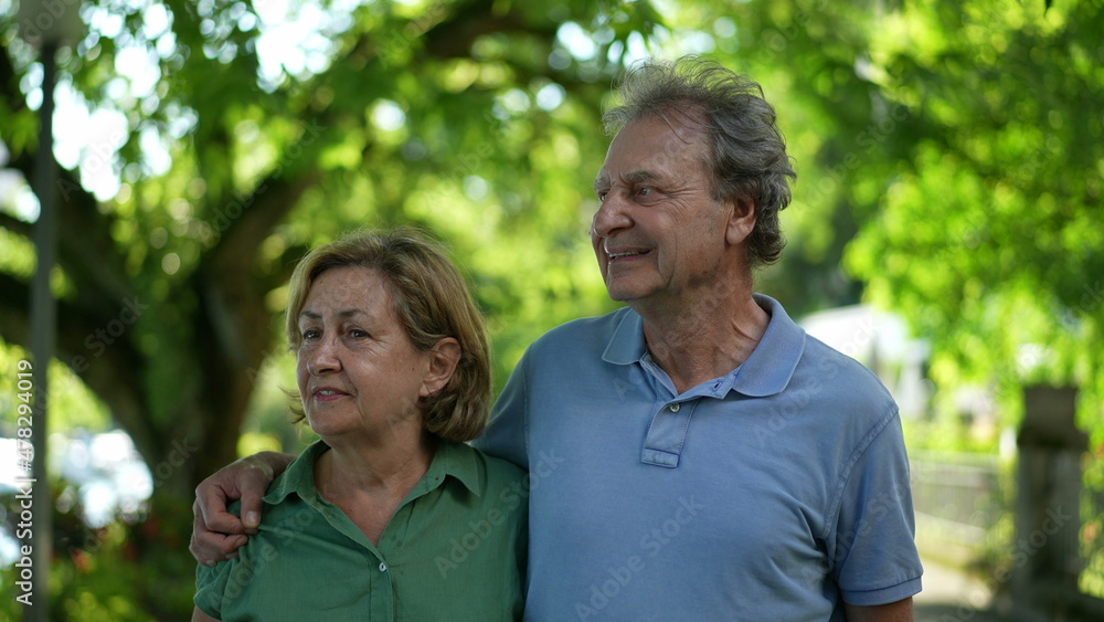 Fototapeta premium Happy senior couple walking together in afternoon walk