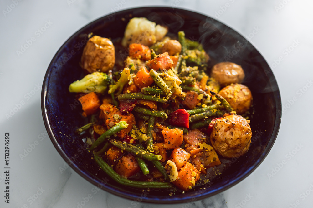 vegan mixed vegetable roast with gravy sauce, healthy plant-based food vegan mixed vegetable roast with gravy sauce, healthy plant-based food