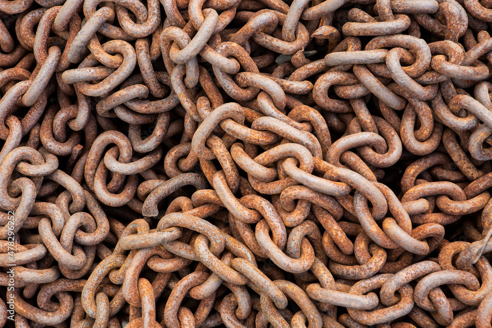 close up macro of a old rusty pile of metal industrial chain close up macro of a old rusty pile of metal industrial chain