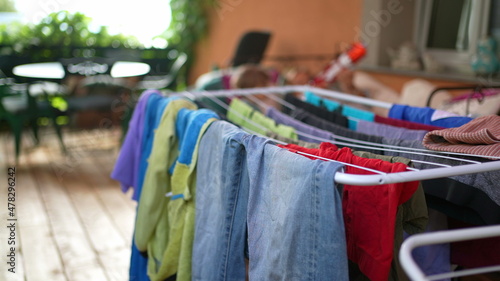 Drying of colourful clothes. Laundry drying racks