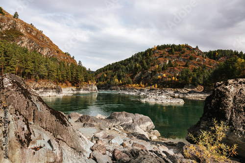 Mountain river surrounded by high rocks in Altai