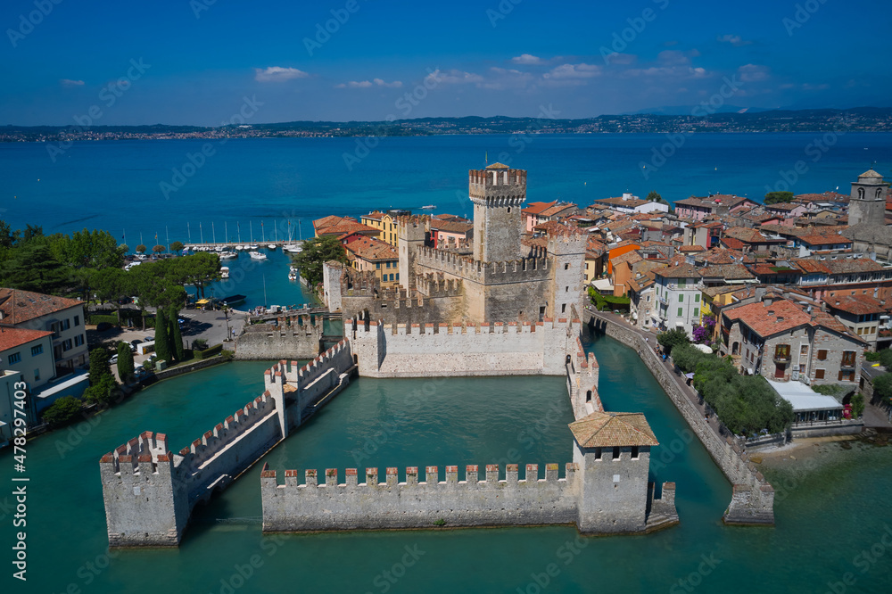 Aerial view on Sirmione sul Garda. Italy, Lombardy. View by Drone. Rocca Scaligera Castle in Sirmione. An ancient village on southern Garda Lake.