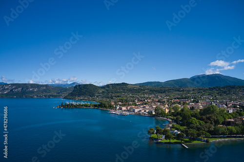 Aerial view of Bardolino, Lake Garda, Italy. Panorama of the historic town of Bardolino. Top view of the historic part of the city of Bardolino on the coastline of Lake Garda.