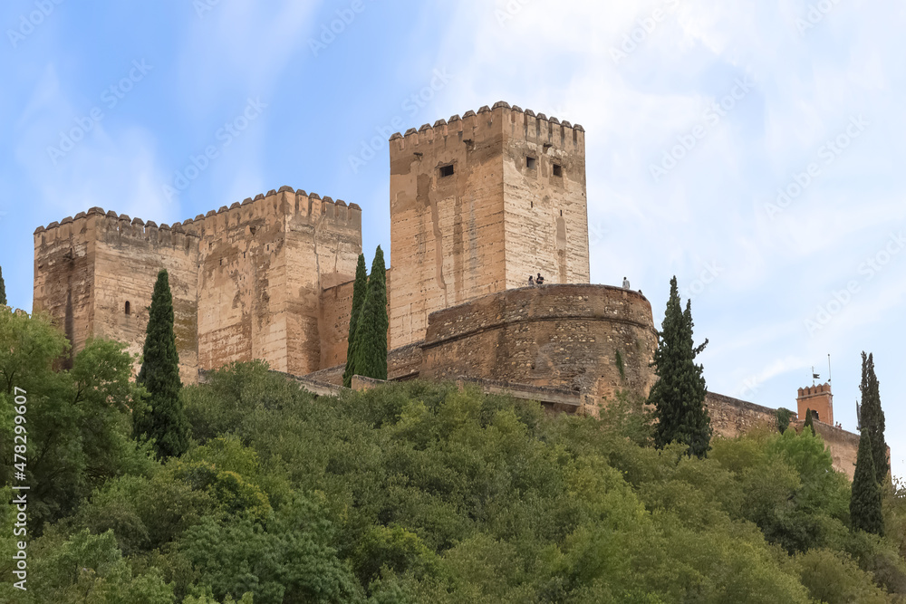 View at the Alhambra citadel towers fortress, from Paseo de los Tristes, walk of the sad (The Promenade of the Sad), Granada, Spain
