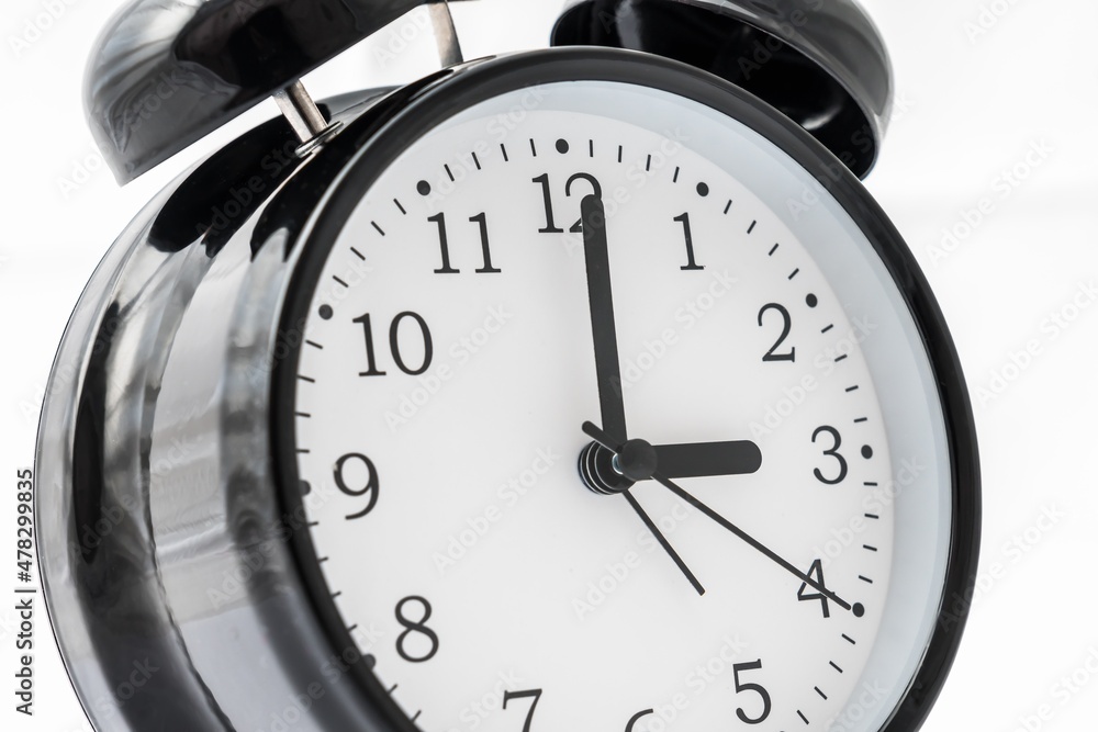 Alarm clock with double bell - winter and summer time concept Alarm clock with double bell - winter and summer time concept