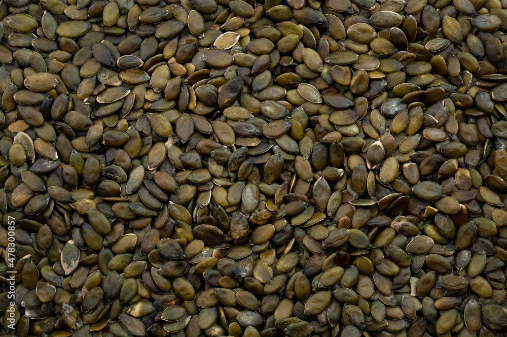 Nourishment is cultivated, abundance of nutritious food and harvest horizontal backgrounds concept with full frame image of stack of shelled pumpkin seeds and no people Nourishment is cultivated, abundance of nutritious food and harvest horizontal backgrounds concept with full frame image of stack of shelled pumpkin seeds and no people