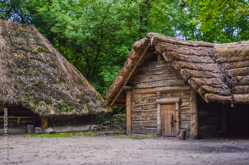 Ancient wooden house in Biskupin village, Poland photo