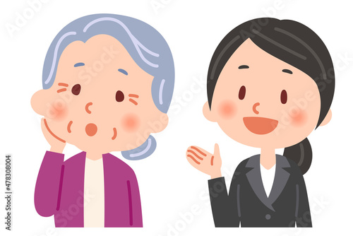 説明をするビジネスマンと説明を聞くおばあさん