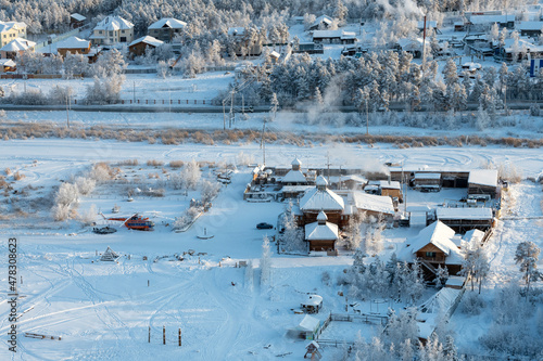 Yakutsk city on a winter day. View from a height of the ethnographic tourist complex "Chochur Muran"