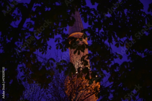 The minaret of a mosque at night in Istanbul is suitable for Ramadan